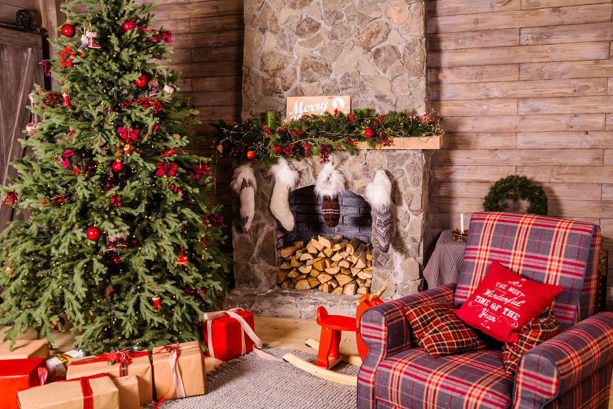 A gift for someone with an open fireplace: a decorated fireplace with stacked wood at Christmas
